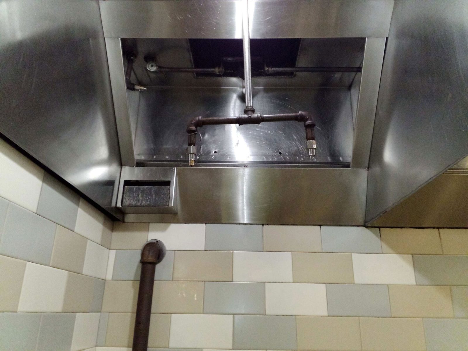 Commercial kitchen hood cleaned to bare stainless